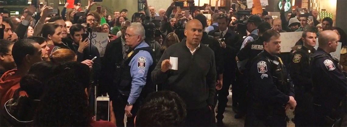 Senator Cory Booker (D-NJ), at Dulles International Airport, speaking to protestors against President Trump's travel ban.